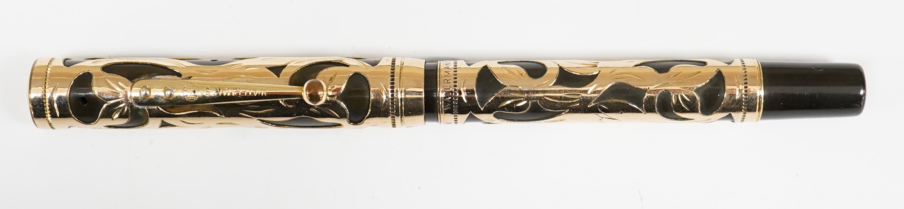 A Waterman gold filled filigree Eyedropper fitted with 14ct. gold No.4 Waterman nib